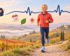 Uomo di mezza età corre a passo leggero su un sentiero tra colline e vigneti in autunno; un tracciato ECG unisce un orologio sportivo a un cuore rosso